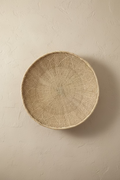 Natural Ilala palm wall basket, 40–44 cm, with a pale circular woven pattern.