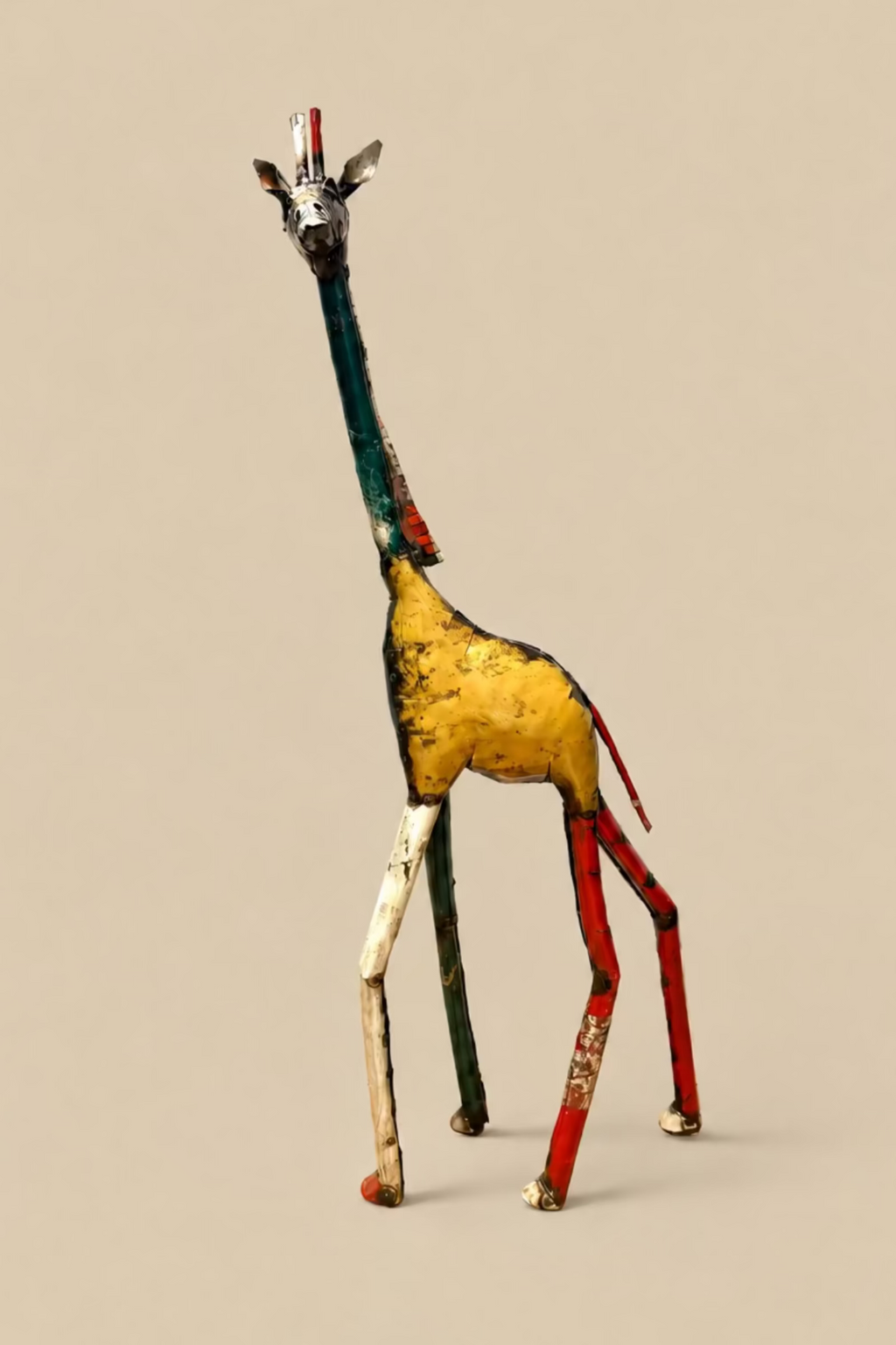 Tall Giraffe metal sculpture with a yellow body and green neck, shown at an angle.