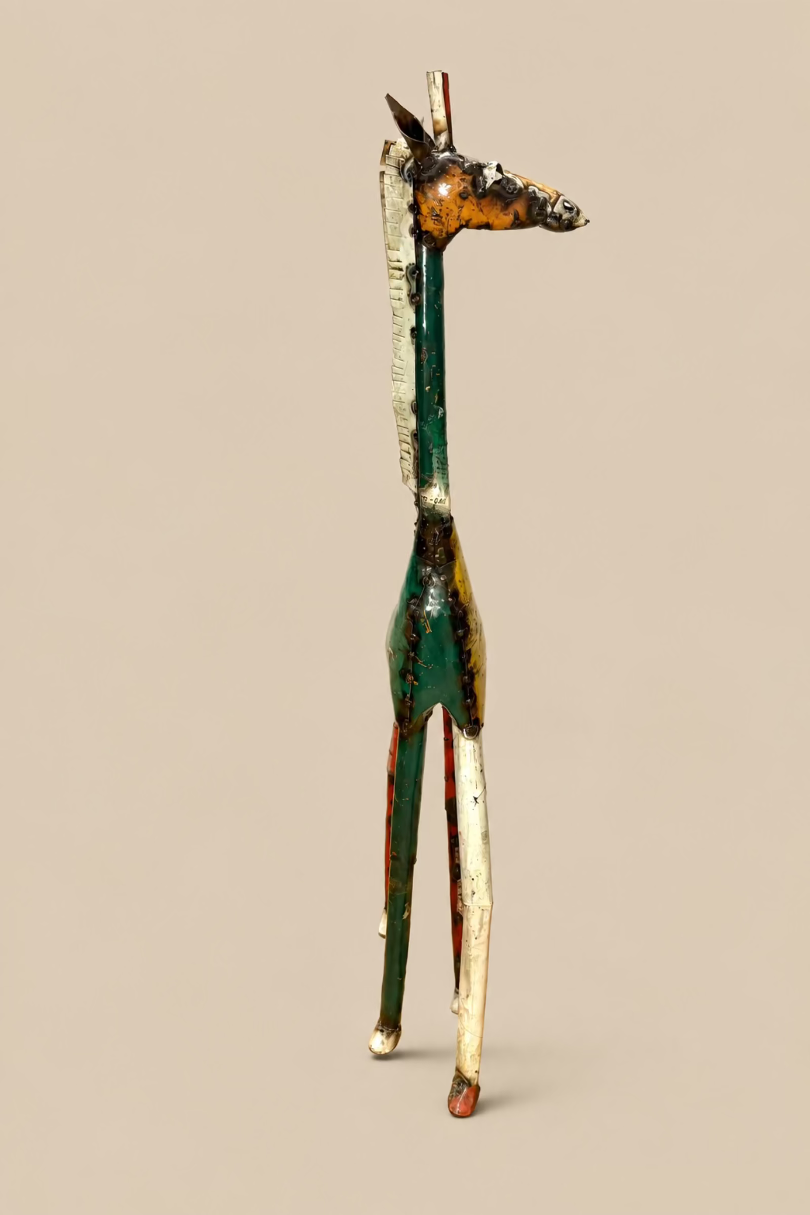Tall Giraffe metal sculpture with green and cream panels, side view.