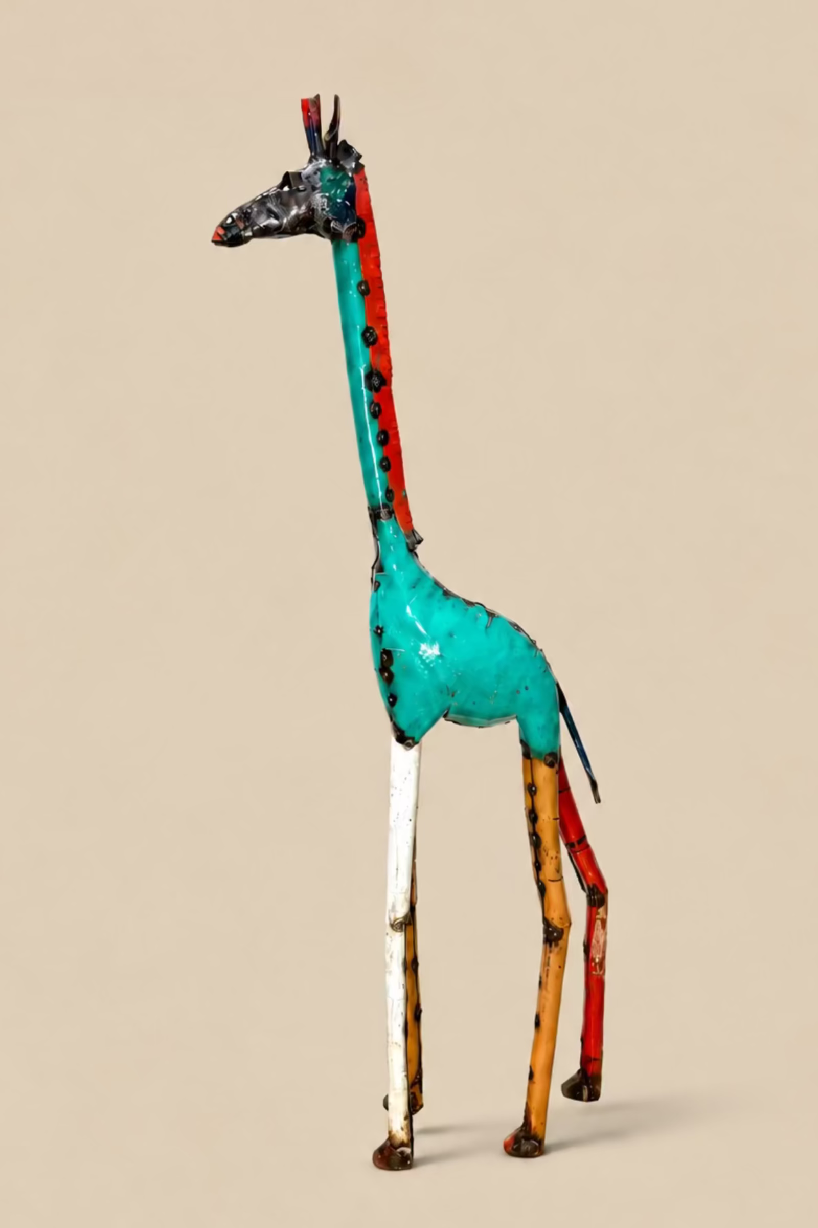 Tall Giraffe metal sculpture with turquoise panels and a long upright neck, side view.