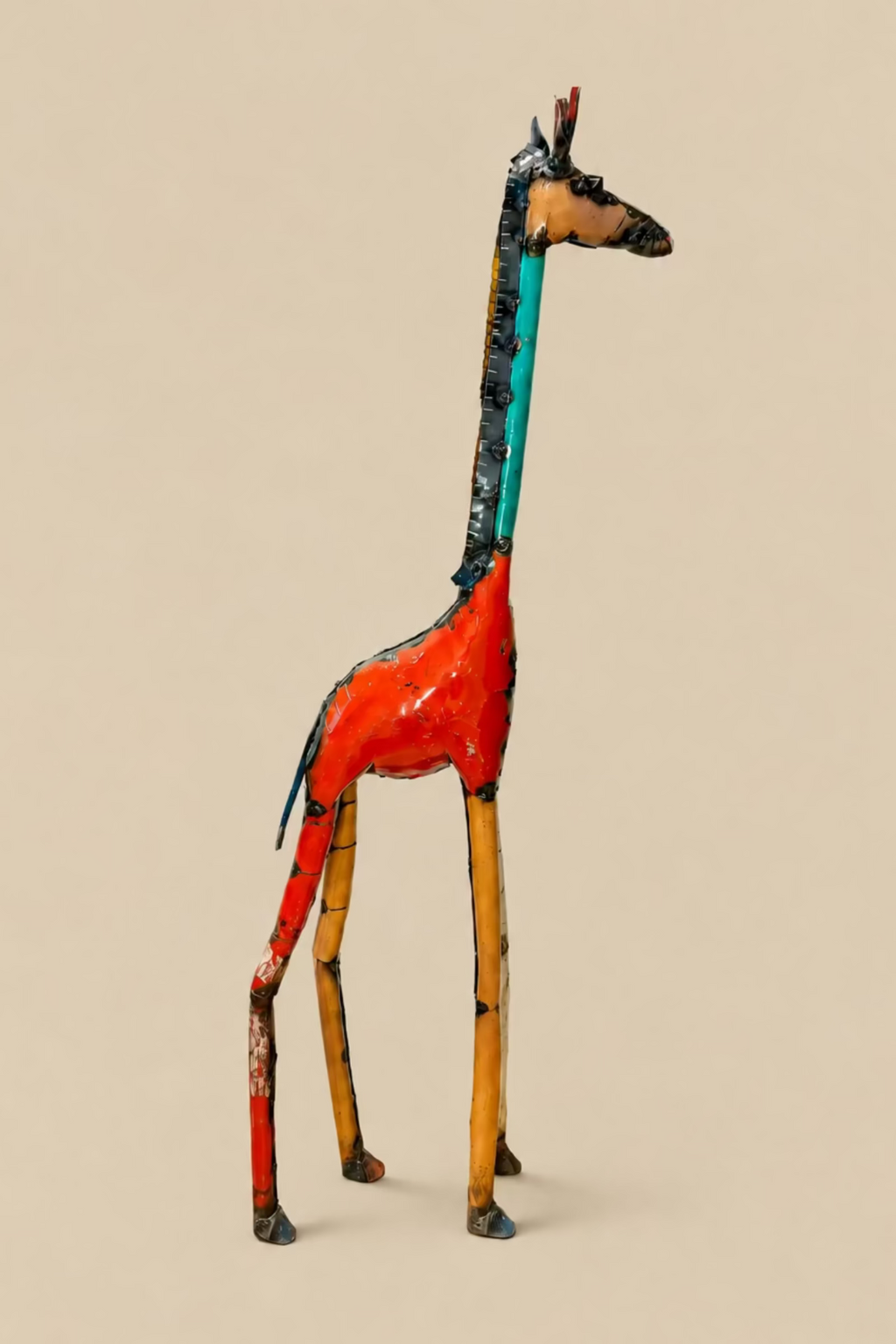 Tall Giraffe metal sculpture with red and turquoise panels, viewed from the other side.
