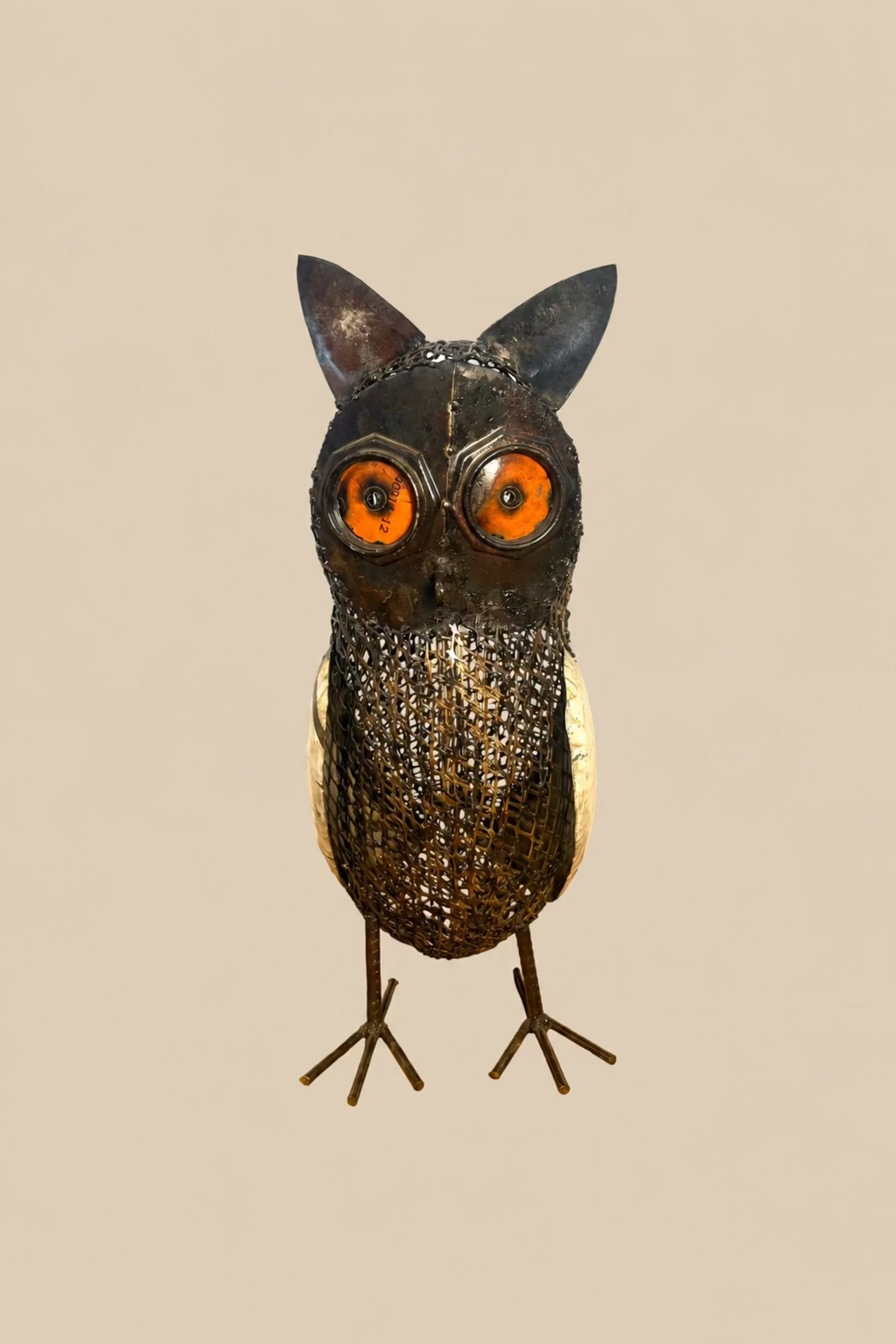 Sentinel Owl metal sculpture with amber-orange eyes and a mesh body, front view.