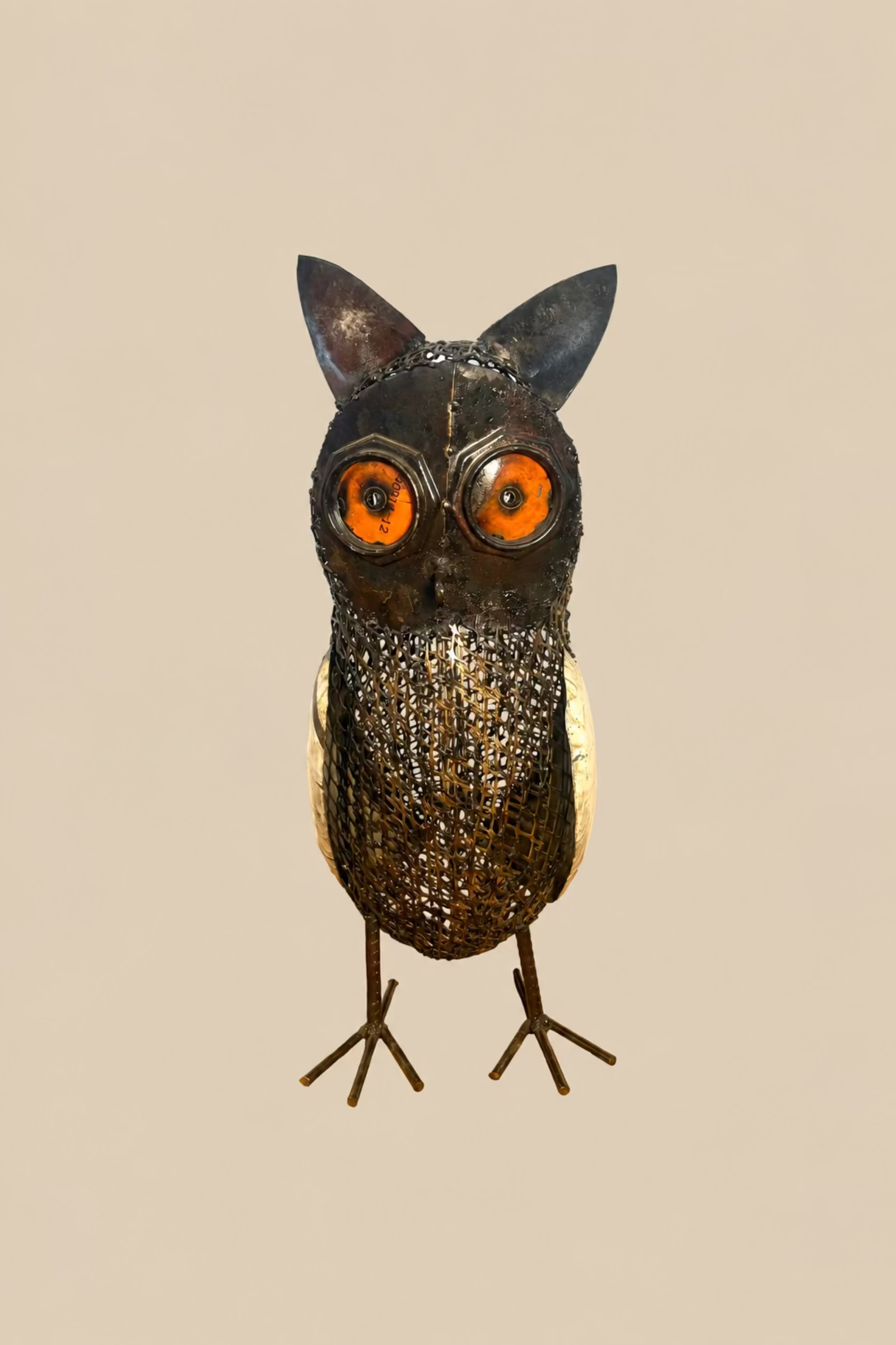 Sentinel Owl metal sculpture with amber-orange eyes and a mesh body, front view.