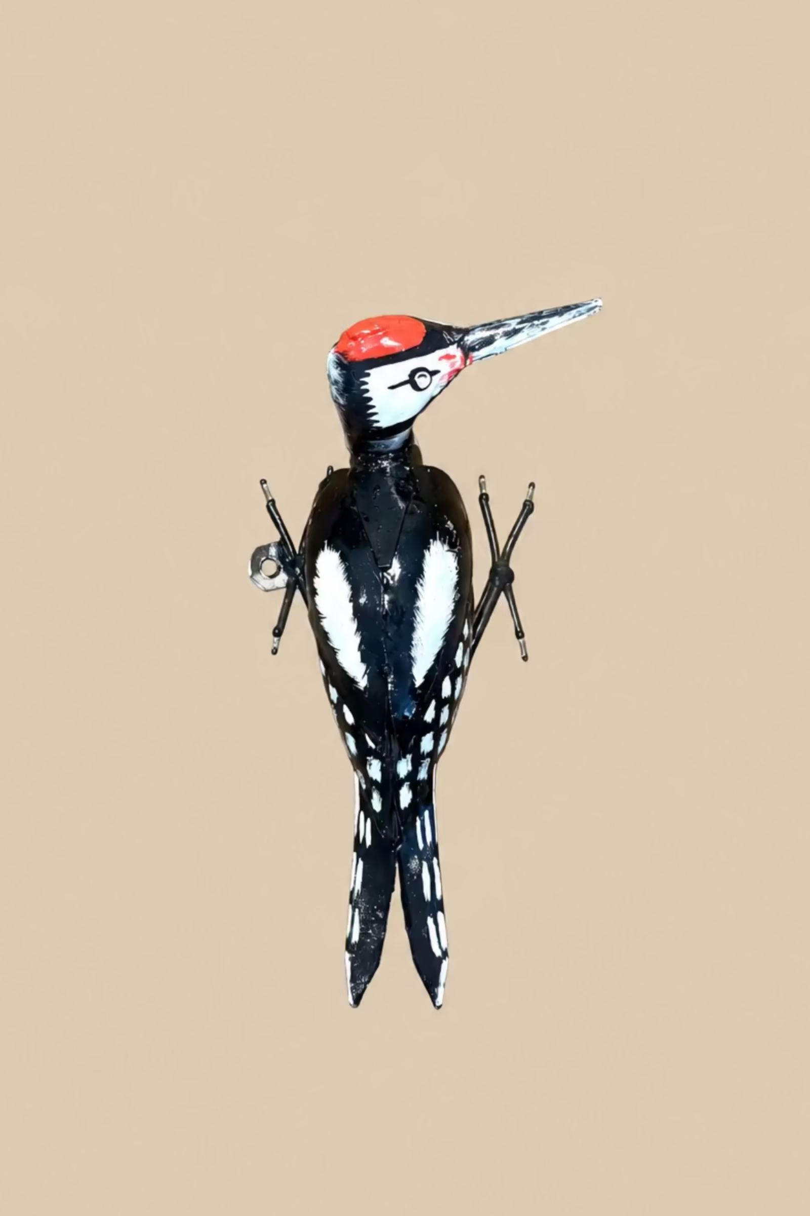 Crimson-Crowned Woodpecker metal wall sculpture with a red crown and black-and-white wings and tail.