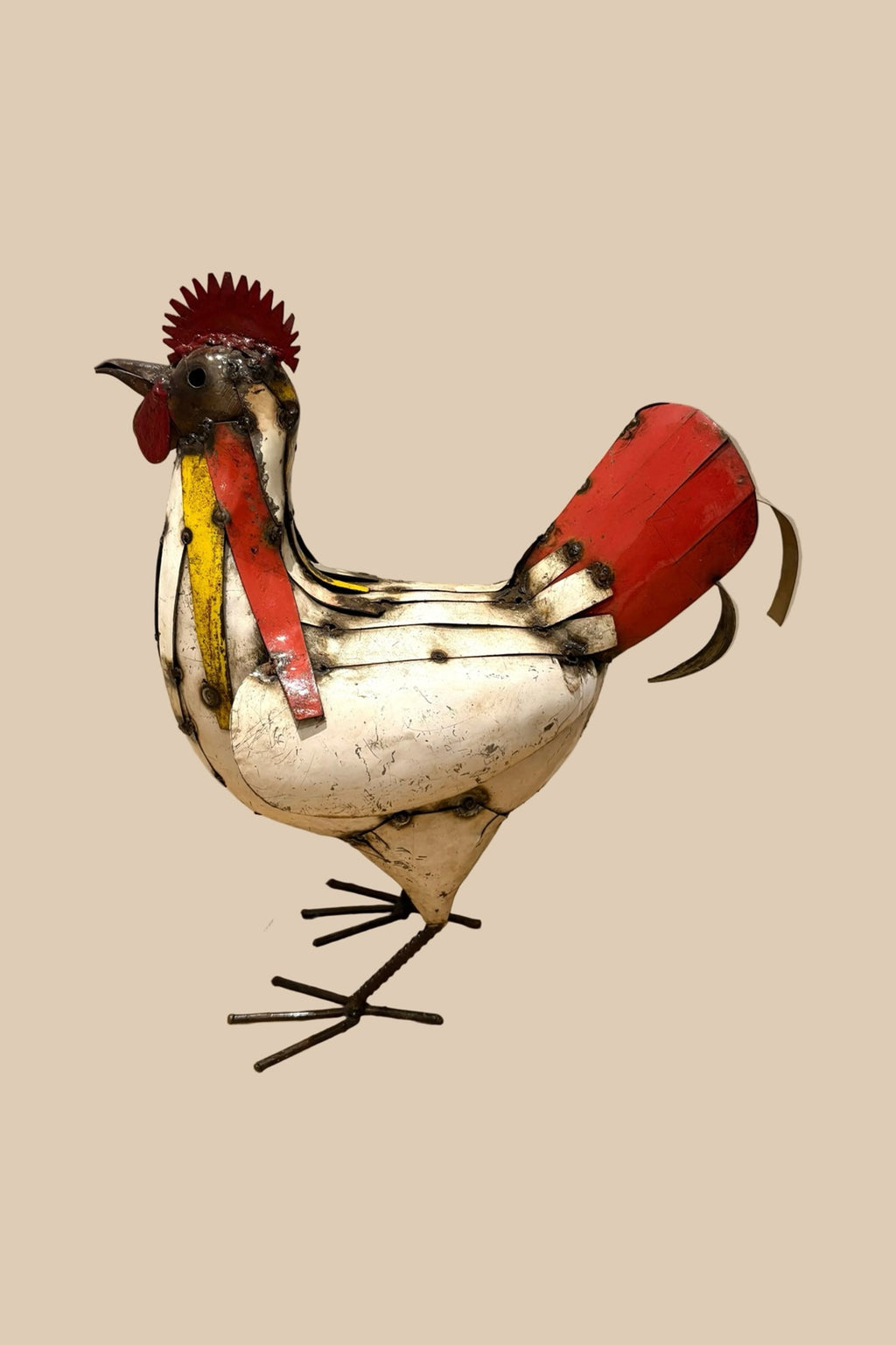 Patchwork Cockerel with a cream body, red tail and colourful neck feathers, in side profile.