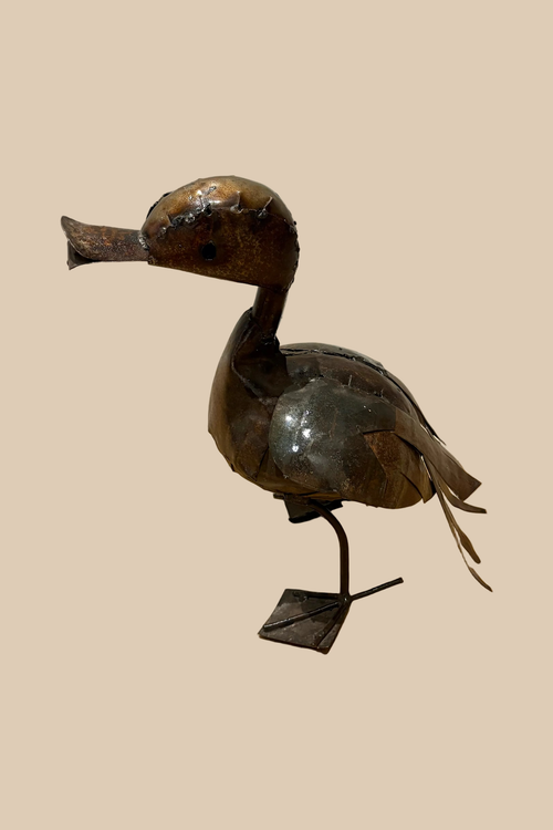 Calling Duck sculpture in dark metal with an open bill and webbed feet, in side profile.