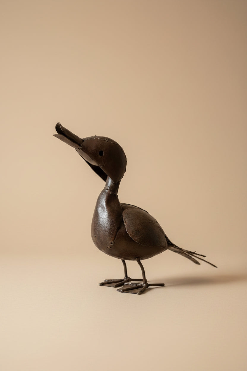 Calling Duck recycled metal sculpture on a pale plinth