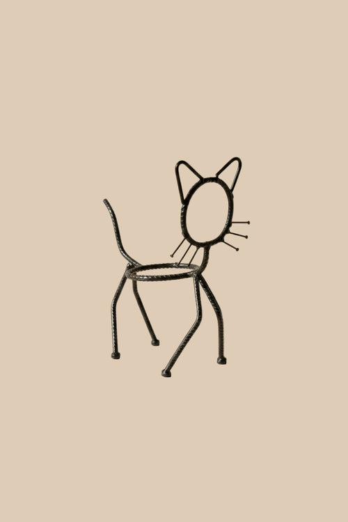 Cat Planter Stand in dark recycled metal, showing its empty pot holder against a beige background.