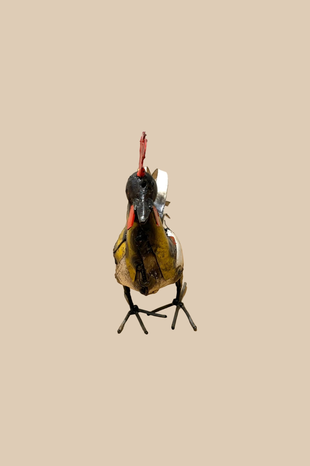 Small Cockerel metal sculpture with a red comb, yellow chest and pale tail feathers, viewed from the front.